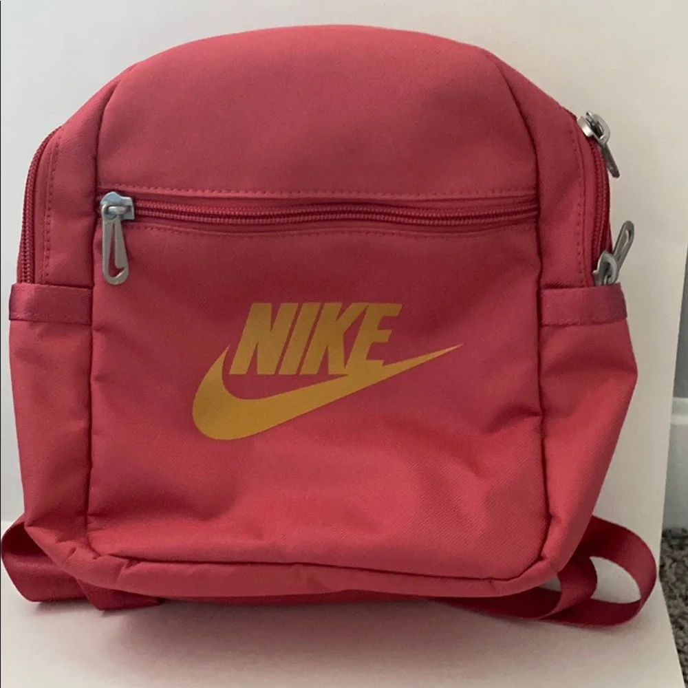Nike Pink Futura 365 Mini Backpack. Size 10x8x4 inches. Gold Nike Swoosh. NWT